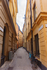 very narrow street between the yellow houses. Stockholm, swedish vacation