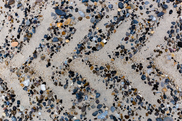 Stones in the sand on danish beach