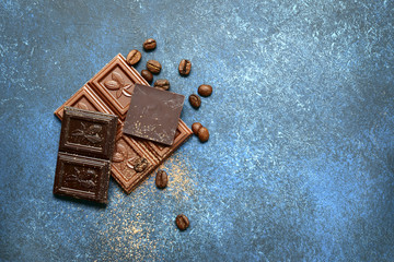 Chocolate slices with  coffee beans.Top view with copy space.