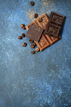 Chocolate slices with  coffee beans.Top view with copy space.