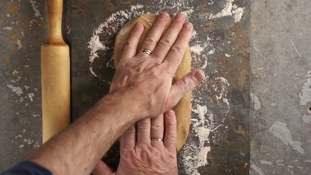 Man pulls the dough for pasta. Video