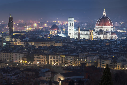Cathedral of Florence rising above the city in the night