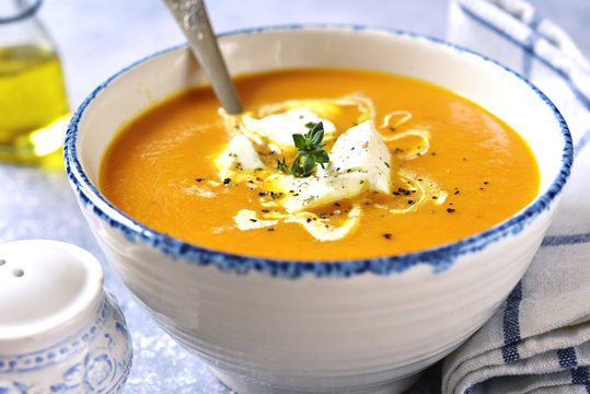 Thick pumpkin soup with feta cheese and thyme.