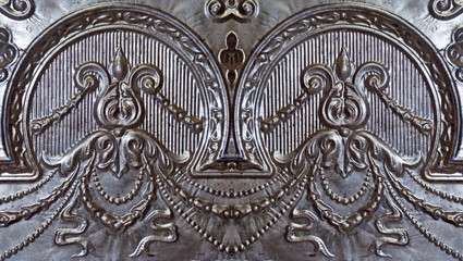 Old ornate silver painted tin ceiling tiles