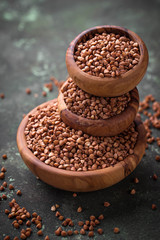 Buckwheat groats in wooden bowl