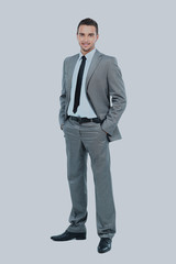 Full body portrait of happy smiling business man, isolated on white background.