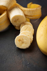 Fresh sliced banana on dark background