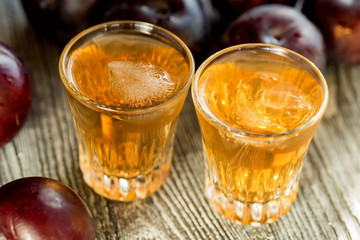 Plum brandy or slivovitz with fresh and tasty plum