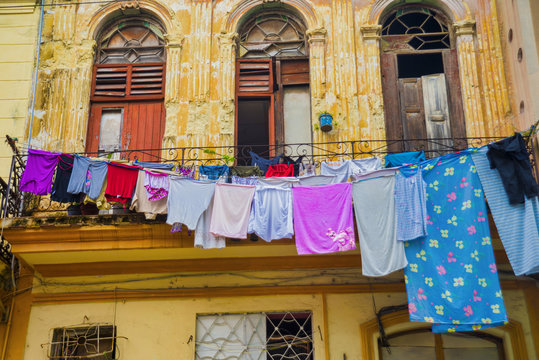 Urban scene with old colonial building facade in Old Havana, Cuba