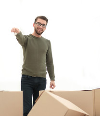 smiling man showing keys of new apartments