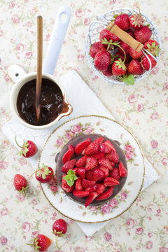 Traditional chocolate strawberry cheesecake with fresh strawberries as top view on a plate