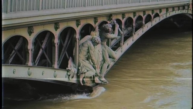 Pont de Bir-Hakeim and swollen river Seine embankments overflow floodings in Paris - news footage - vintage film VHS effect