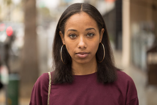 Young black woman serious face portrait