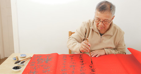 Man wiring Chinese calligraphy
