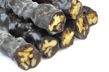 Turkish sweet, walnut raisin sausage on white background.