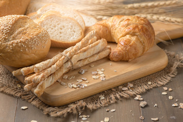 Homemade bread sticks, croissant and bread