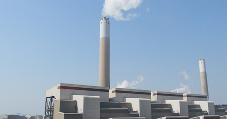 Smoke stack on blue sky