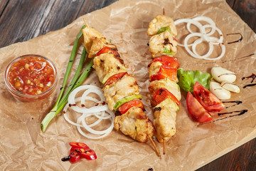 Chicken meat kebab with sauces and vegetables