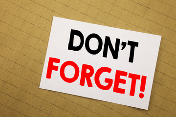 Conceptual hand writing text caption inspiration showing Do Not Forget. Business concept for Reminder Message Written on sticky note yellow background.