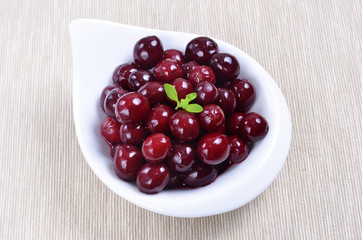  Red berries on white plate 