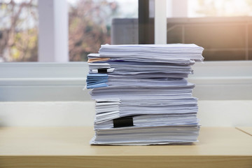 Business and finance concept of office working, Pile of unfinished documents on office desk, Stack of business paper