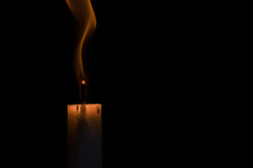 the candle goes out at black background