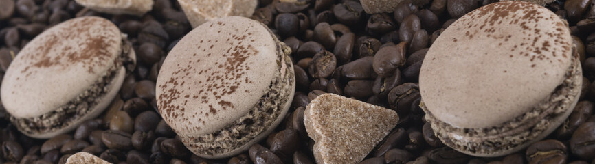 set of coffee biscuits with sugar hearts lying on coffee beans