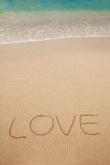 the inscriptions of love on sand beach