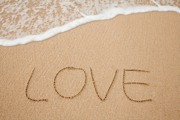 the inscriptions of love on sand beach