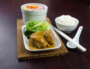 Chicken and herb soup in pot, Chinese food style.