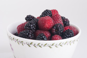 raspberry and blackberry on white isolated background