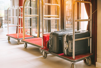 Hotel luggage cart / baggage trolley in the hotel lobby hallway background or Bellman's luggage cart
