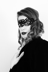 Fototapeta premium amazing beautiful woman. portrait. carnaval mask, choker, bodysuit, mens jacket, big boobs. bw, black and white photo. retro. 50 shades of grey. isolated.