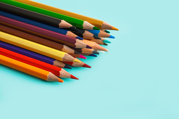 Fototapeta premium colored pencils on pastel background