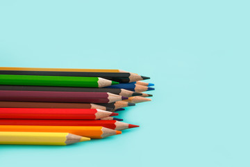 Fototapeta premium colored pencils on pastel background