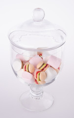 Obraz na płótnie Canvas Candies. colorful candies in glass jar on background