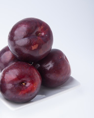 Plum. Ripe plum fruit on background