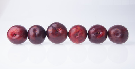 Plum. Ripe plum fruit on background