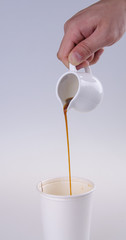 Pouring Coffee into a cup.