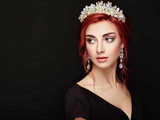 Beautiful girl in the crown and earrings. Perfect makeup. Beauty fashion. Cosmetic. Elegant...