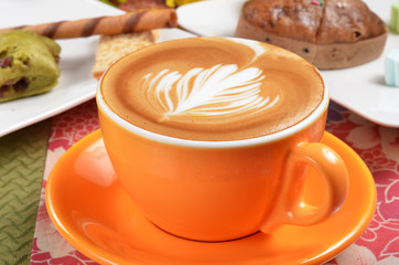 Cappuccino with latte art on the crema.