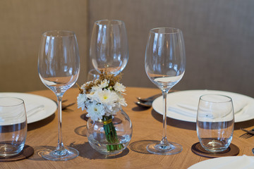 Empty glasses wine in restaurant. Glass water.dish spoon fork on table at restaurant