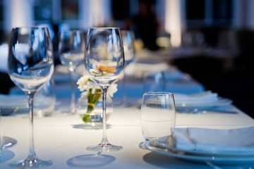 Empty glasses wine in restaurant. Glass water.dish spoon fork on table at restaurant