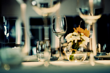 Empty glasses wine in restaurant. Glass water.dish spoon fork on table at restaurant