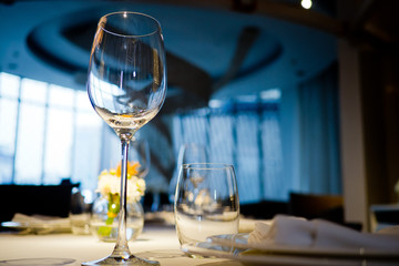 Empty glasses wine in restaurant. Glass water.dish spoon fork on table at restaurant