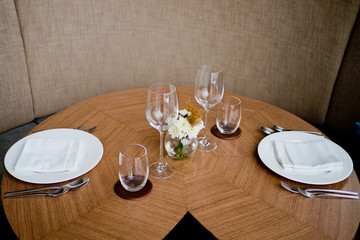 Empty glasses wine in restaurant. Glass water.dish spoon fork on table at restaurant