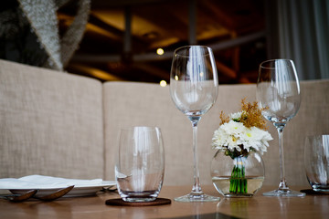 Empty glasses wine in restaurant. Glass water.dish spoon fork on table at restaurant