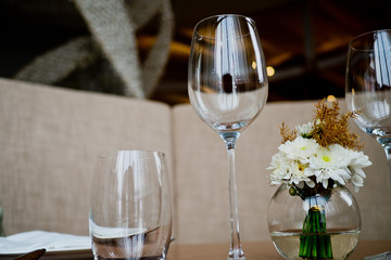 Empty glasses wine in restaurant. Glass water.dish spoon fork on table at restaurant