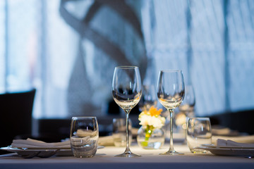 Empty glasses wine in restaurant. Glass water.dish spoon fork on table at restaurant