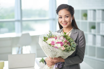 Business woman with flowers